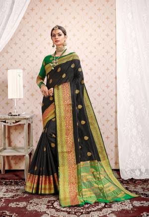 Flaunt Your Rich And Elegant Taste Wearing This Designer Silk based Saree In Black Color Paired With Green Colored Blouse. This Saree And Blouse Are fabricated On Cotton Silk Beautified With Attractive Weave. Buy This Saree Now.