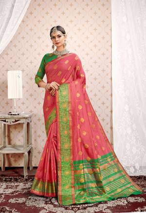 Adorn the Pretty Angelic Look In This Designer Silk Based Saree In Pink Color Paired With Green Colored Blouse. This Saree And Blouse Are Fabricated On Cotton Silk Beautified With Weave Giving The Saree An Attractive Look.