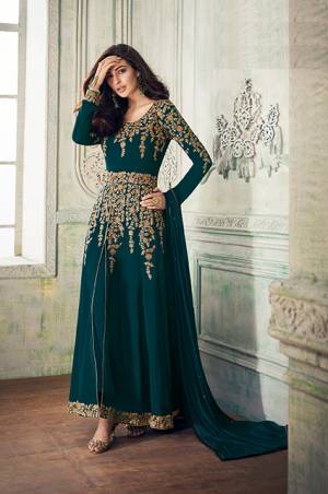 Add This Beautiful Designer To Your Wardrobe In Peacock Blue Color Paired With Peacock Blue Colored Bottom And Dupatta. Its Beautiful Embroidered Top Is Fabricated On Georgette Paired With Santoon Bottom And Chiffon Fabricated Dupatta. Its Rich Embroidery Pattern Is Giving The Suit An Attractive Look. 