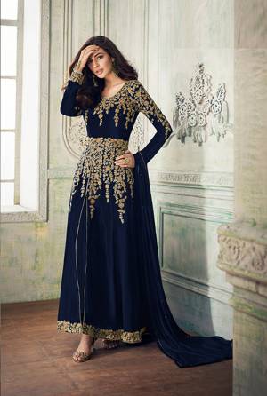 Add This Beautiful Designer To Your Wardrobe In Navy Blue Color Paired With Navy Blue Colored Bottom And Dupatta. Its Beautiful Embroidered Top Is Fabricated On Georgette Paired With Santoon Bottom And Chiffon Fabricated Dupatta. Its Rich Embroidery Pattern Is Giving The Suit An Attractive Look. 