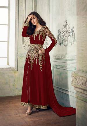 Add This Beautiful Designer To Your Wardrobe In Dark Red Color Paired With Dark Red Colored Bottom And Dupatta. Its Beautiful Embroidered Top Is Fabricated On Georgette Paired With Santoon Bottom And Chiffon Fabricated Dupatta. Its Rich Embroidery Pattern Is Giving The Suit An Attractive Look. 
