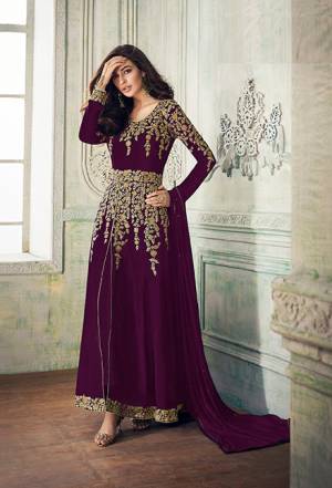 Add This Beautiful Designer To Your Wardrobe In Purple Color Paired With Purple Colored Bottom And Dupatta. Its Beautiful Embroidered Top Is Fabricated On Georgette Paired With Santoon Bottom And Chiffon Fabricated Dupatta. Its Rich Embroidery Pattern Is Giving The Suit An Attractive Look. 