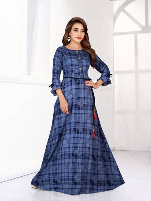 Look Pretty In This Designer Readymade Gown In Blue Color. This Gown Is Fabricated On Rayon Beautified With Checks And Floral Prints All Over It. 