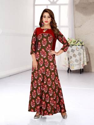 Simple And Elegant Looking Readymade Gown Is Here In Olive Green And Red This Pretty Gown Is Fabricated On Rayon Beautified With All Over Prints. 