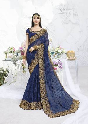 Catch All The Limelight Wearing This Heavy Designer Saree In Blue Color Paired With Blue Colored Blouse. This Heavy Embroidered Saree Is Fabricated Net Paired With Art Silk Fabricated Blouse. 
