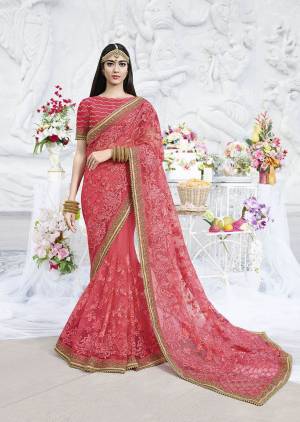 Look Attractive In This Heavy Designer Pink Colored Saree Paired With Pink Colored Blouse. This Saree Is Fabricated On Net Paired With Art Silk Fabricated Blouse. It Is Beautified With Heavy Tone To Tone Embroidery Over The Saree And Blouse. 