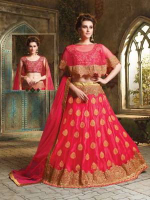 Here Is A Very Beautiful Cape Patterned Heavy Designer Lehenga Choli In All Over Fuschia Pink Color. Its Blouse Is Fabricated On Art Silk Paired With Jacquard Net Lehenga And Chiffon Fabricated Dupatta. This Lehenga Choli Is Beautified With Heavy Embroidery And Its Lovely Pattern Will Earn You Lots Of Compliments From Onlookers. 