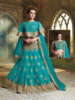 Here Is A Very Beautiful Cape Patterned Heavy Designer Lehenga Choli In All Over Turquoise Blue Color. Its Blouse Is Fabricated On Art Silk Paired With Jacquard Net Lehenga And Chiffon Fabricated Dupatta. This Lehenga Choli Is Beautified With Heavy Embroidery And Its Lovely Pattern Will Earn You Lots Of Compliments From Onlookers. 