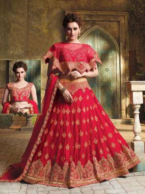 Here Is A Very Beautiful Cape Patterned Heavy Designer Lehenga Choli In All Over Red Color. Its Blouse Is Fabricated On Art Silk Paired With Jacquard Net Lehenga And Chiffon Fabricated Dupatta. This Lehenga Choli Is Beautified With Heavy Embroidery And Its Lovely Pattern Will Earn You Lots Of Compliments From Onlookers. 