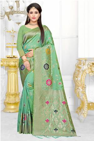 Here Is A Beautiful Saree To Add Into Your Wardrobe For The Upcoming Festive Season. Grab This Sea Green Colored Saree Paired With Sea Green Colored Blouse. This Saree And Blouse Are Fabricated On Art Silk Beautified With Weave. 