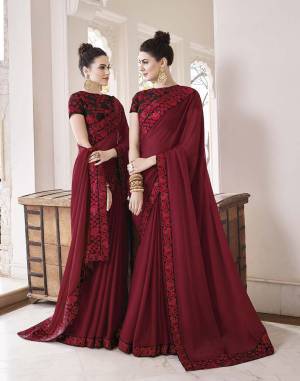 For Royal And Elegant Look, Grab This Designer Saree In Maroon Color Paired With Black Colored Blouse. This Saree Is Fabricated On Silk Georgette Paired With Art Silk Fabricated Blouse. Its Blouse And Saree Border Are Beautified With Attractive Embroidery. 