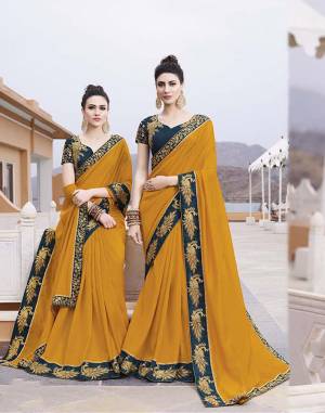 Catch All The Limelight At The Function You Attend Wearing This Designer Saree In Musturd Yellow Color Paired With Contrasting Blue Colored Blouse. This Saree IS Fabricated on Vichitra Silk Paired With Art Silk Fabricated Blouse. 