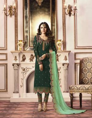 Go with The Pretty Shades Of Green With This Heavy Designer Straight Suit In Dark Green Colored Top And Bottom Paired With Light Green Colored Dupatta. Its Top Is Fabricated On Satin Georgette Paired With Santoon Bottom And Georgette Fabricated Dupatta. All Three Piece Are Beautified With Heavy Attractive Embroidery Work.
