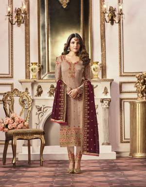 Flaunt Your Rich And Elegant Taste With This Evergreen Combination, Wearing This Heavy Designer Straight Suit In Beige Color Paired With Contrasting Maroon Colored Dupatta. Its Top Is Fabricated On Satin Georgette Paired With Santoon Bottom And Georgette Fabricated Dupatta. 