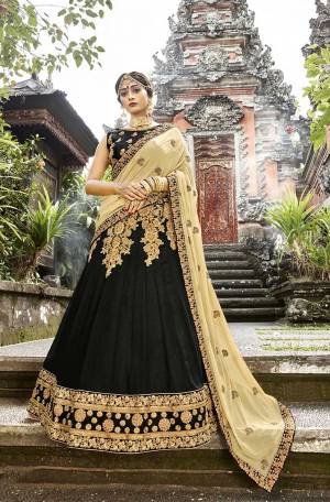 Enhance Your Personality Wearing This Heavy Designer Lehenga Choli In Black Color Paired With Beige Colored Dupatta. Its Blouse Is Fabricated On Art Silk Paired With Georgette Fabricated Lehenga And Chiffon Fabricated Dupatta. All Three Piece Are Beautified With Heavy Embroidery Making It More Attractive. 