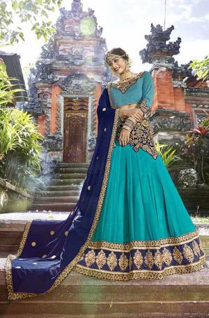 Go With The Shades Of Blue With This Heavy Designer Lehenga Choli In Blue Color Paired With Contrasting Royal Blue Colored Dupatta. Its Blouse Is Fabricated On Art Silk Paired With Georgette Fabricated Lehenga And Chiffon Fabricated Dupatta. 