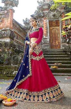 Bright And Visually Appealing Color Pallete Is Here With This Heavy Designer Lehenga Choli In Dark Pink Color Paired With Contrasting Royal Blue Colored Dupatta. Its Blouse Is Fabricated On Art Silk Paired With Georgette Fabricated Lehenga And Chiffon Dupatta. Its Bright Colors And Attractive Embroidery Will Give You A Look Like Never Before. 
