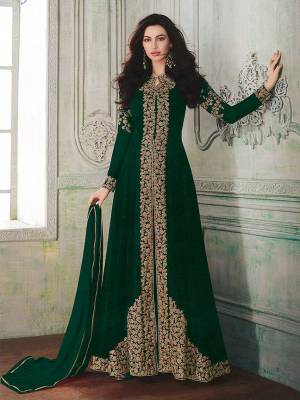 Look beautiful in this Dark Green Colored georgette front slit flair suit with embroidered floral patterns on the Top. Comes with matching Santoon bottom and Chiffon dupatta. Buy Now.