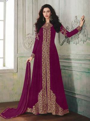 Look beautiful in this Magenta Pink Colored georgette front slit flair suit with embroidered floral patterns on the Top. Comes with matching Santoon bottom and Chiffon dupatta. Buy Now.
