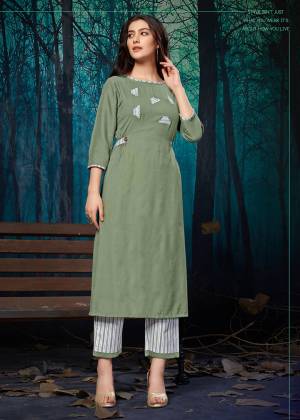 For Your Semi-Casuals, Grab This Readymade Plazzo Set In Mint Green Colored Kurti Paired With White Colored Plazzo. Its Top Is Fabricated On Rayon Paired With Khadi Cotton Bottom. It Is Beautified With Pretty Elegant Applique Work. 