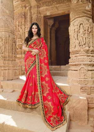 Adorn The Pretty Angelic Look Wearing This Heavy Designer Shaded Saree In Crimson Red Color Paired With Maroon Colored Blouse. This Saree Is Silk Georgette Based Paired With Art Silk Fabricated Blouse. 