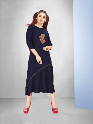Enhance Your Personality Wearing This Designer Readymade Kurti In Navy Blue Color Fabricated On Rayon. It Is Beautified With Work Making It More Attractive. 