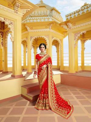 Celebrate This Festive Season With Beauty And Comfort Wearing This Attractive Looking Saree In Red Color Paired With Red Colored Blouse. This Heavy Embroidered Saree Is Fabricated On Georgette Paired With Art Silk Fabricated Blouse. Buy This Saree Now.