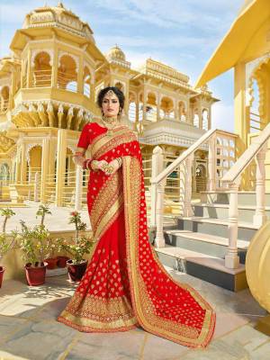 Look Attractively Beautiful In This Heavy Designer Saree In Red. This Saree Is Georgette Based Beautified With Heavy Embroidery. This Pretty Saree Is Durable And Easy To Carry Throughout The Gala.