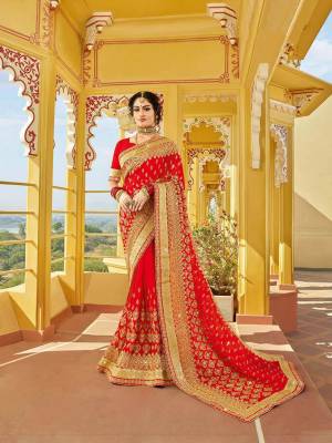 Look Attractively Beautiful In This Heavy Designer Saree In Red. This Saree Is Georgette Based Beautified With Heavy Embroidery. This Pretty Saree Is Durable And Easy To Carry Throughout The Gala.