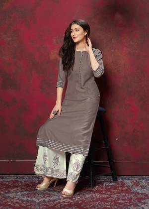 Grab This Very Pretty Designer Readymade Plazzo Set In Grey Colored Top Paired With Off-White Colored Bottom. This Kurti And Plazzo Are Fabricated On Cotton And Available In All Regular Sizes. Buy This Pretty Pair Now.