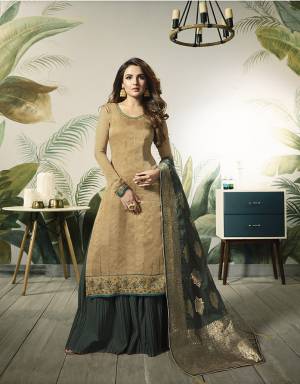 Add This Very Pretty Designer Indo-Western Suit To Your Wardrobe?For The Upcoming Festive And Wedding Season. Its Beige Colored Top Is Fabricated On Satin Silk Paired With Contrasting Pine Green Colored Bottom And Dupatta. Its Bottom Is Fabricated On Santoon Paired With Jacquard Silk Fabricated Dupatta. Buy Now