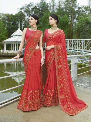 Adorn This Pretty Angelic Look Wearing This Designer Saree In Crimson Red Color Paired With Crimson Red Colored Blouse. This Saree Is Georgette Based Paired With Art Silk Fabricated Blouse. It Is Easy To Drape And Carry All Day Long. 