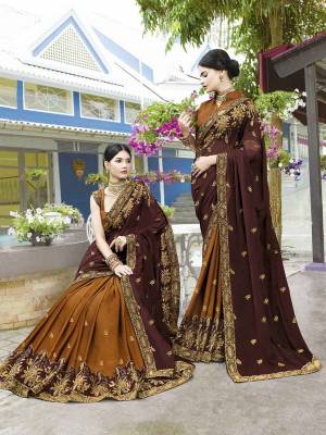 Celebrate This Festive Season Wearing This Heavy Designer Saree In Brown And Musturd Yellow Color Paired With Musturd Yellow Colored Blouse. This Saree Is Fabricated On Soft Silk And Chiffon Paired With Art Silk Fabricated Blouse. Buy Now.