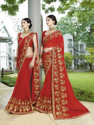 Adorn This Pretty Angelic Look Wearing This Designer Saree In Red Color Paired With Red Colored Blouse. This Saree Is Georgette Based Paired With Art Silk Fabricated Blouse. It Is Easy To Drape And Carry All Day Long. 