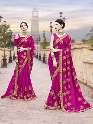 Bright And Visually Appealing Color Is Here With This Heavy Designer Saree In Rani Pink Color Paired With Rani Pink Colored Blouse. This Saree Is Georgette  Based Paired With Art Silk Fabricated Blouse,Beautified With Attractive Embroidery. 