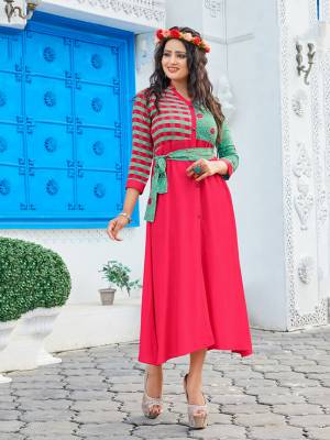 Add This Very Pretty Designer Patterned Readymade Kurti To Your Wardrobe In Dark Pink Color Fabricated on Rayon. It Is Light In Weight And Easy To Carry All Day Long. 