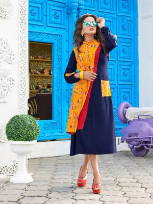 For Your Semi-Casuals, Grab This Readymade Kurti In Navy Blue Color Fabricated On Rayon. Its Unique Pattern And Color Pallete Will Earn You Lots Of Compliments From Onlookers.