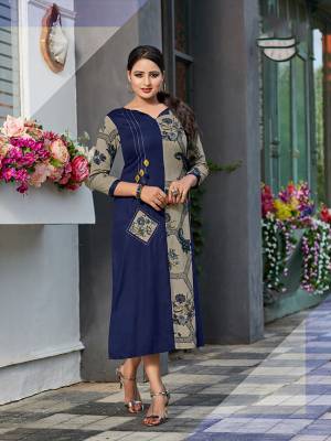Add This Very Pretty Designer Patterned Readymade Kurti To Your Wardrobe In Blue And Grey Color Fabricated on Rayon. It Is Light In Weight And Easy To Carry All Day Long. 