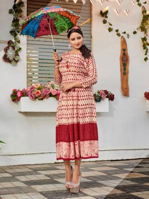 Simple And Elegant Looking Designer Readymade Kurti Is Here In Off-White And Red Color Fabricated On Rayon. It Is Soft Towards Skin And Easy To Carry All Day Long. 