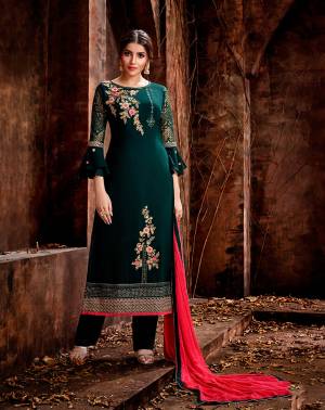 New Shade Is Here To Add Into Your Wardrobe With This Designer Straight Suit In Teal Blue Color Paired With Contrasting Rani Pink Colored Dupatta. Its Top Is Fabricated On Georgette Beautified With Attractive And Contrasting Work Paired With Santoon Bottom And Chiffon Fabricated Dupatta. Buy This Now.