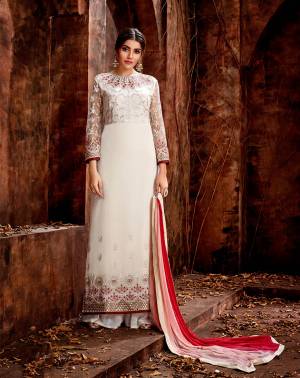 Simple And Elegant Looking Designer Straight Suit Is Here In White Color Paired With Red And White Colored Dupatta. Its Top Is Georgette Based Beautified With Embroidery Over Yoke, Sleeves And Panel Paired With Santoon Bottom And Chiffon Fabricated Dupatta. 