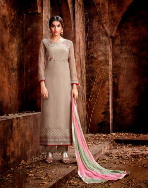 Flaunt Your Rich And Elegant Taste Wearing This Designer Straight Suit In Sand Grey Color Paired With Contrasting Shaded Dupatta In Baby Pink And Pastel Green Color. Its Elegant Embroidered Top With Minimal Embroidery Is Georgette Based Paired With Santoon Bottom And Chiffon Fabricated Dupatta. 