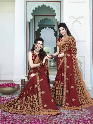 Here Is A Royal And Heavy Designer Saree In Maroon Color Paired With Maroon Colored Blouse. This Heavy Embroidered Saree Is Silk Georgette Based Paired With Art Silk Fabricated Blouse. Its Rich Fabric And Color Will Give A Royal Look Like Never Before. 