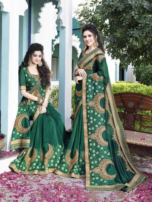 Celebrate This Festive Season With Beauty And Comfort Wearing This Heavy Designer Saree In Pine Green Color Paired With Pine Green Colored Blouse. This Saree Is Fabricated On Saton Silk Paired With Art Silk Fabricated Blouse. It Has Very Pretty New Patterned Attractive Embroidery. 