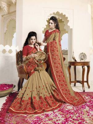 Evergreen Pattern and Color Combination Is Here With This Heavy Designer Saree In Beige Color Paired With Contrasting Red Colored Blouse. This Saree And Blouse Are fabricated on Art Silk Beautified With Heavy Embroidery. 