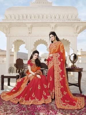 Grab This Attractive Looking Shaded Heavy Designer Saree In Shades Of Orange And Red Color Paired With Red Colored Blouse. This Saree Is Soft Silk Based Paired With Art Silk Fabricated Blouse. It Is Easy To Drape And Durable. 