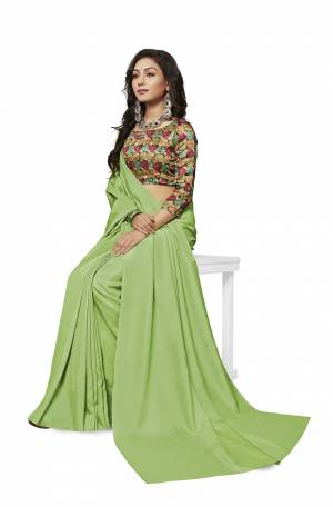 Rich And Elegant Looking Plain Saree IS Here In Light Green Color Paired With Multi Colored Digital Printed Blouse. This Saree And Blouse Are Fabricated On Crepe Silk Which Is Light Weight, Soft Towards Skin And Easy To Carry All Day Long. 