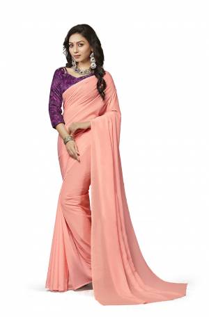 Simplicity Is The Key To Elegance, Grab This Very Pretty Simple And Elegant Looking plain Saree In Dark Peach Color Paired With Purple Colored Digital Printed Blouse. Both The Saree And Blouse Are Crepe Silk Based Which also Ensures Superb Comfort all Day Long. Buy Now.