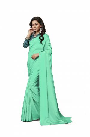 Rich And Elegant Looking Plain Saree IS Here In Sea Green Green Color Paired With Teal Blue Colored Digital Printed Blouse. This Saree And Blouse Are Fabricated On Crepe Silk Which Is Light Weight, Soft Towards Skin And Easy To Carry All Day Long. 