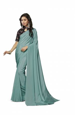 Simplicity Is The Key To Elegance, Grab This Very Pretty Simple And Elegant Looking plain Saree In Steel Blue Color Paired With Black Colored Digital Printed Blouse. Both The Saree And Blouse Are Crepe Silk Based Which also Ensures Superb Comfort all Day Long. Buy Now.